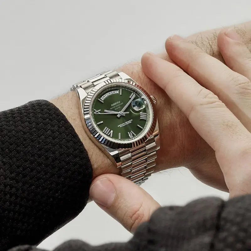 VEXO Day Date Olive watch on wrist – green dial with Roman numerals, stainless steel case and bracelet
