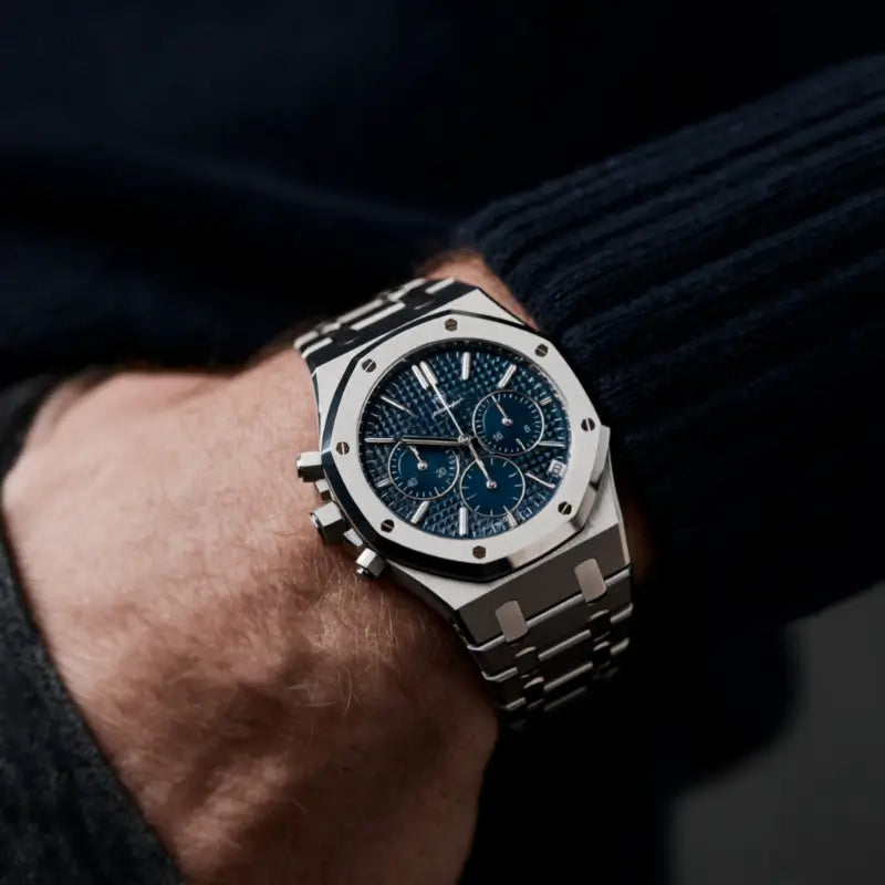 VEXO Kings Oak Chronograph Ocean watch on wrist featuring blue textured dial, stainless steel bracelet, and polished case against dark sweater sleeve