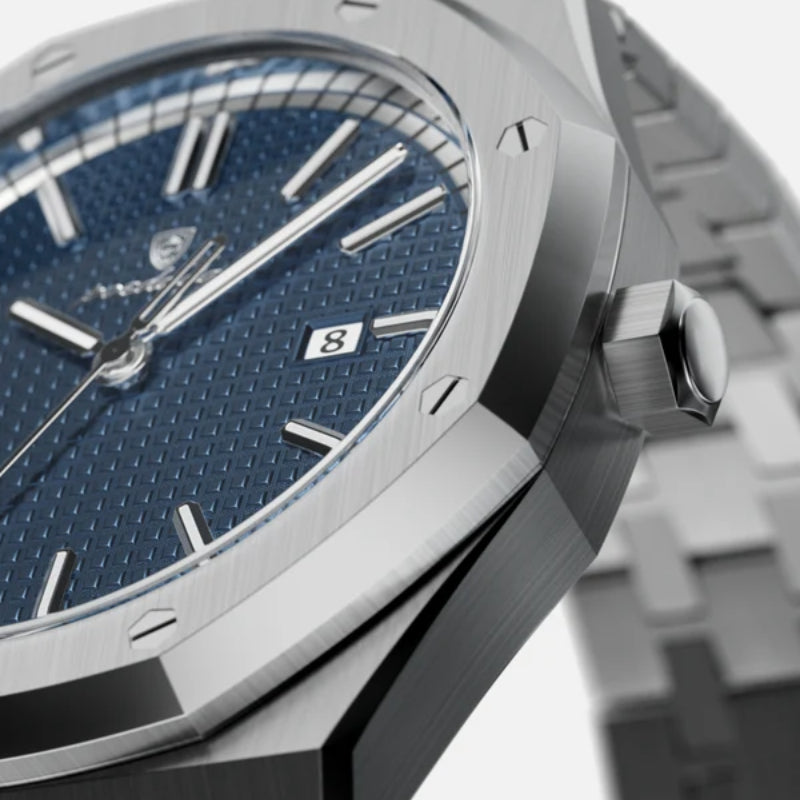 Macro shot of VEXO Kings Oak Ocean watch dial highlighting the detailed blue waffle texture, silver markers, date window, and brushed steel bezel
